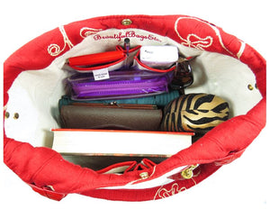 Ivory Leather and Red Tapestry Bucket Bag interior contents